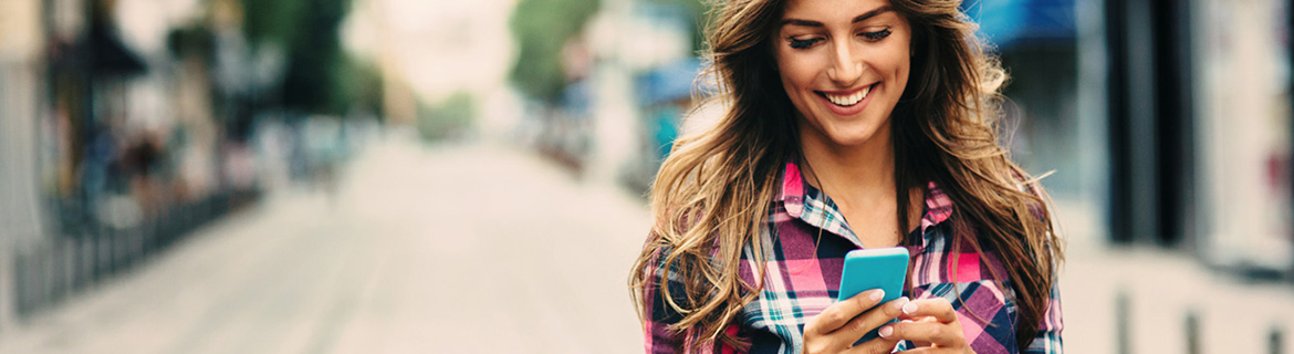 Lady using a smartphone on a walk