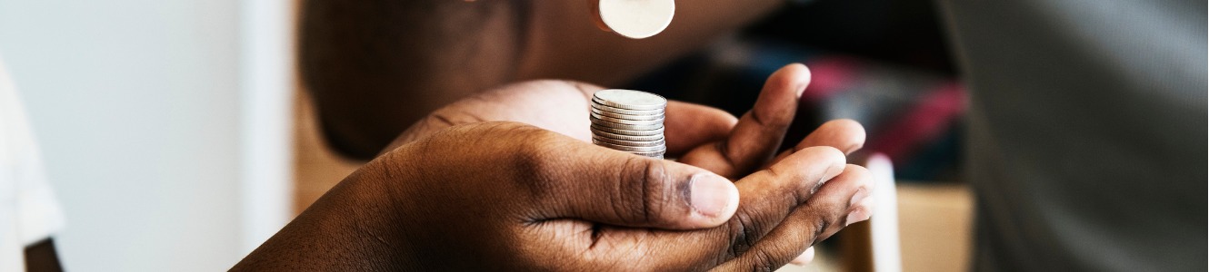 Dad giving coins to daughter