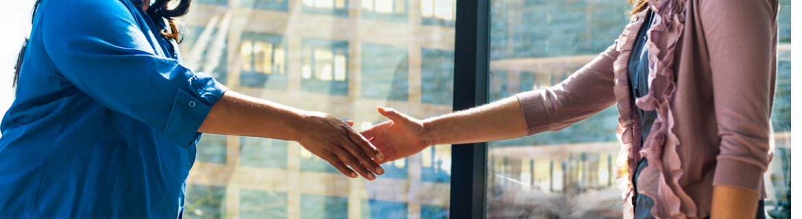 Two Business Women Shaking Hands